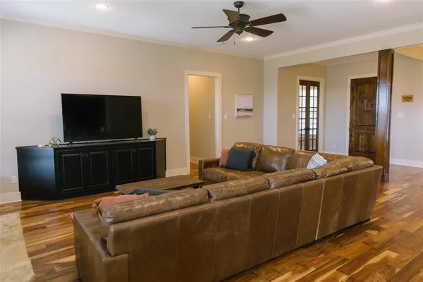 a kitchen with kitchen island granite countertop a stove and a sink