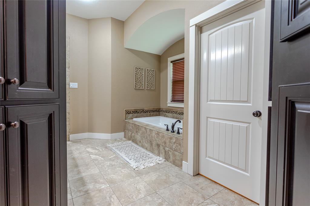 313 Wolf Creek Road Lorena, TX 76655 - Photo 22 of 39 a view of a hallway with washer and dryer
