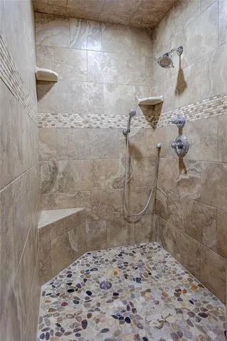 a view of a hallway with washer and dryer