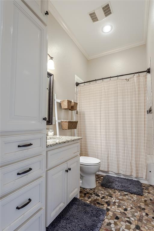 313 Wolf Creek Road Lorena, TX 76655 - Photo 27 of 39 a bathroom with a sink a toilet a mirror and shower curtain