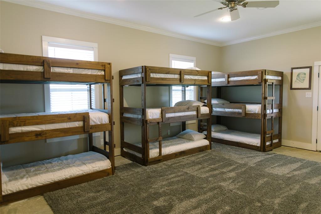 313 Wolf Creek Road Lorena, TX 76655 - Photo 30 of 39 a bedroom with furniture and window