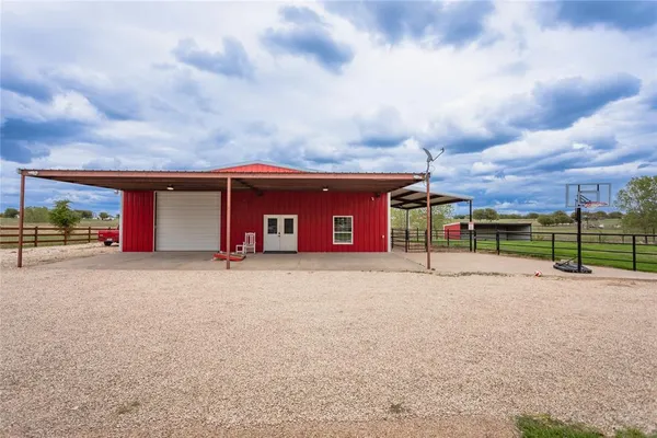 a kitchen with stainless steel appliances granite countertop a refrigerator and a stove