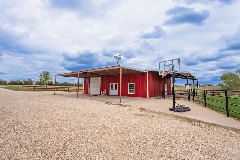 313 Wolf Creek Road Lorena, TX 76655 - Photo 34 of 39 a house with trees in the background