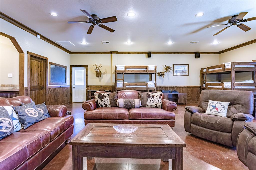 313 Wolf Creek Road Lorena, TX 76655 - Photo 36 of 39 a living room with furniture and a glass door
