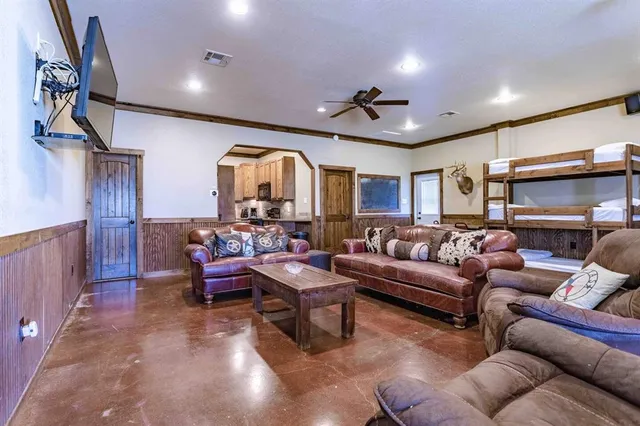 a living room with furniture and a glass door