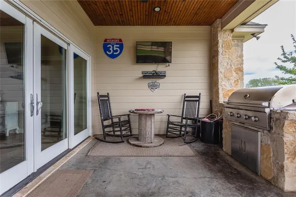 a view of barbecue area and fireplace