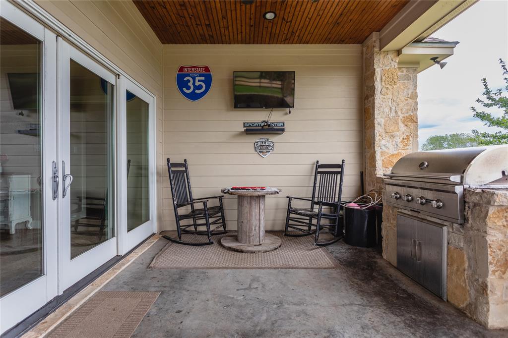 313 Wolf Creek Road Lorena, TX 76655 - Photo 9 of 39 a view of barbecue area and fireplace