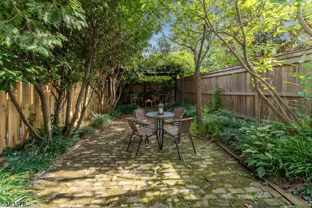 a view of a backyard with sitting area