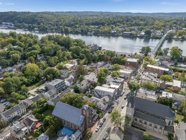 an aerial view of a city with lake view
