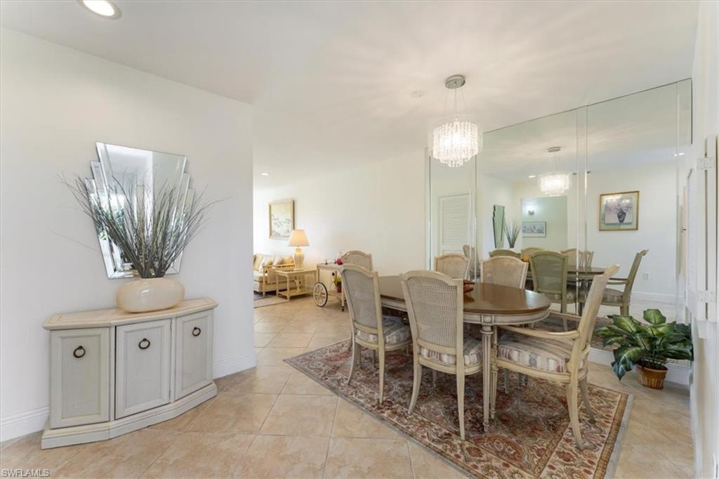 315 St Andrews Boulevard, Unit B32 Naples, FL 34113 - Photo 10 of 27 a view of a dining room with furniture