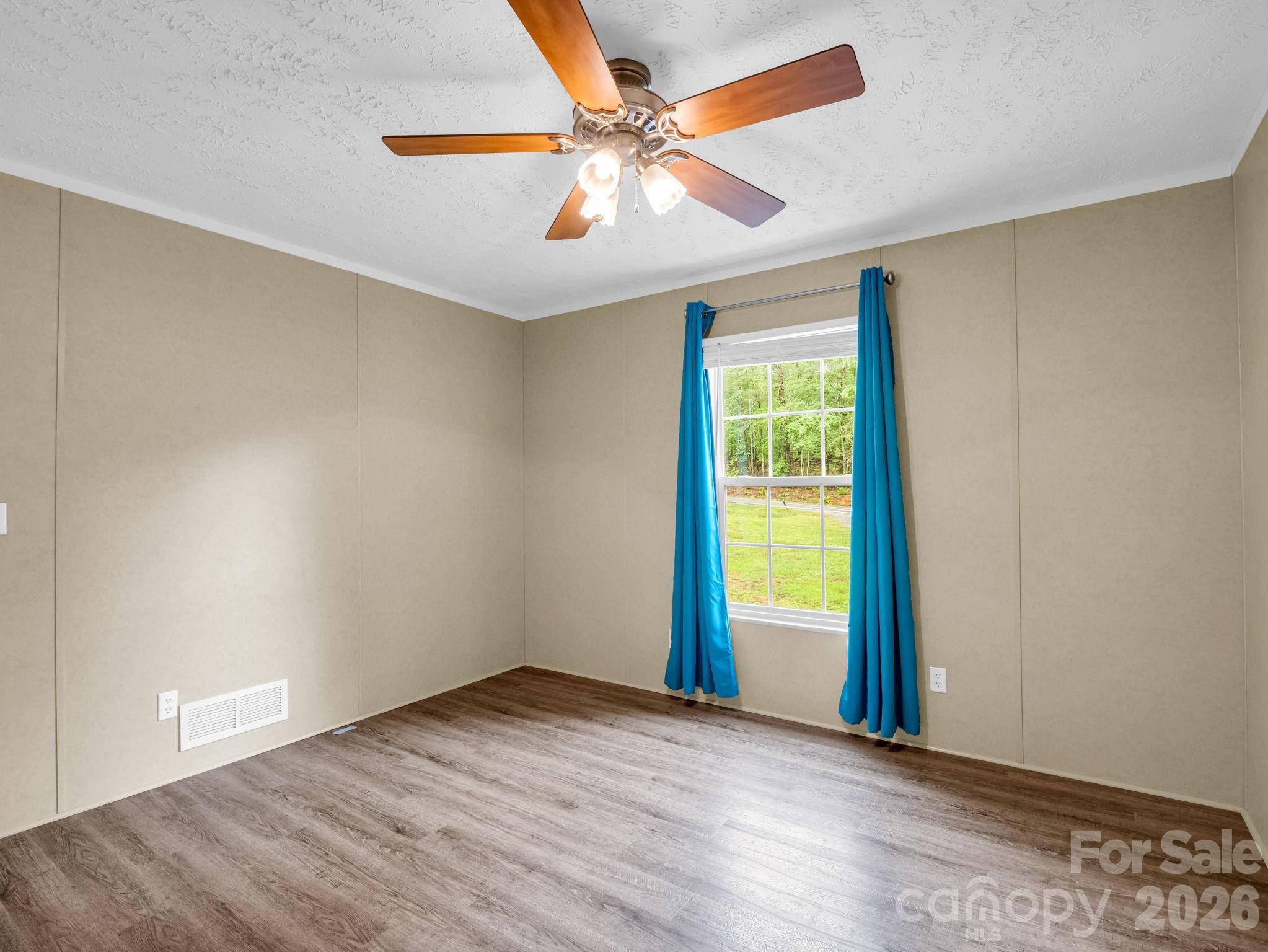 1449 Toney Road Bostic, NC 28018 - Photo 30 of 43 an empty room with windows and fan