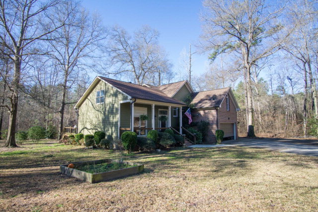 6415 Dobson Road Macon, GA 31220 - Photo 2 of 29 a view of a house with garden and trees