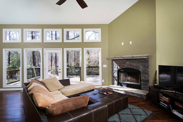 6415 Dobson Road Macon, GA 31220 - Photo 12 of 29 a living room with furniture a flat screen tv and a fireplace