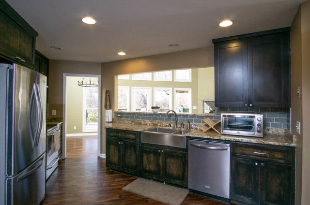 6415 Dobson Road Macon, GA 31220 - Photo 15 of 29 a kitchen with stainless steel appliances granite countertop a sink stove and refrigerator