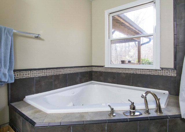 6415 Dobson Road Macon, GA 31220 - Photo 18 of 29 a bath tub sitting next to a window