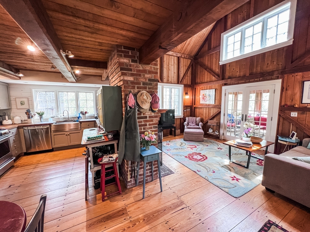 225 Lamberts Cove Road West Tisbury, MA 02568 - Photo 11 of 33 a living room with lots of furniture and kitchen view