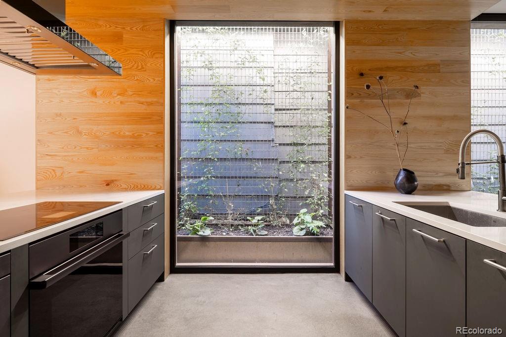 3837 High Street Denver, CO 80205 - Photo 11 of 46 a view of kitchen with sink and refrigerator
