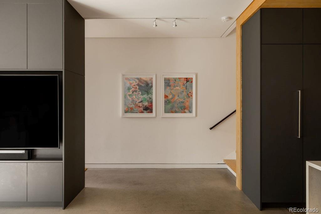 3837 High Street Denver, CO 80205 - Photo 15 of 46 a view of livingroom with furniture and flat screen tv