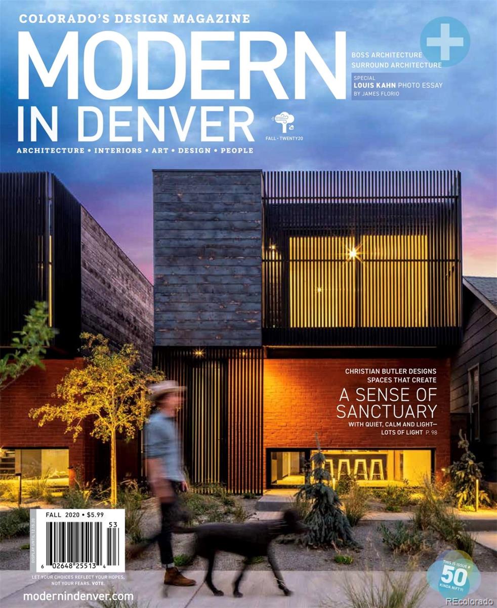 3837 High Street Denver, CO 80205 - Photo 2 of 46 a front view of a building with retail shops and traffic signal