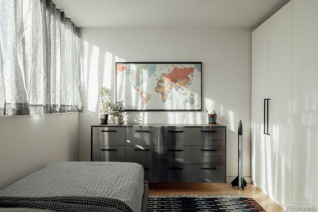 3837 High Street Denver, CO 80205 - Photo 23 of 46 a room with a bed and a window