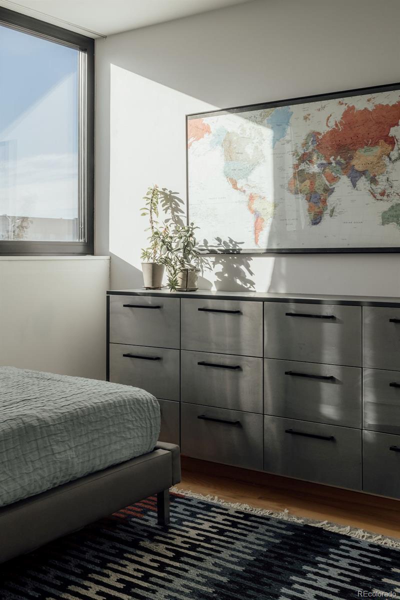 3837 High Street Denver, CO 80205 - Photo 24 of 46 a bedroom with a bed and window