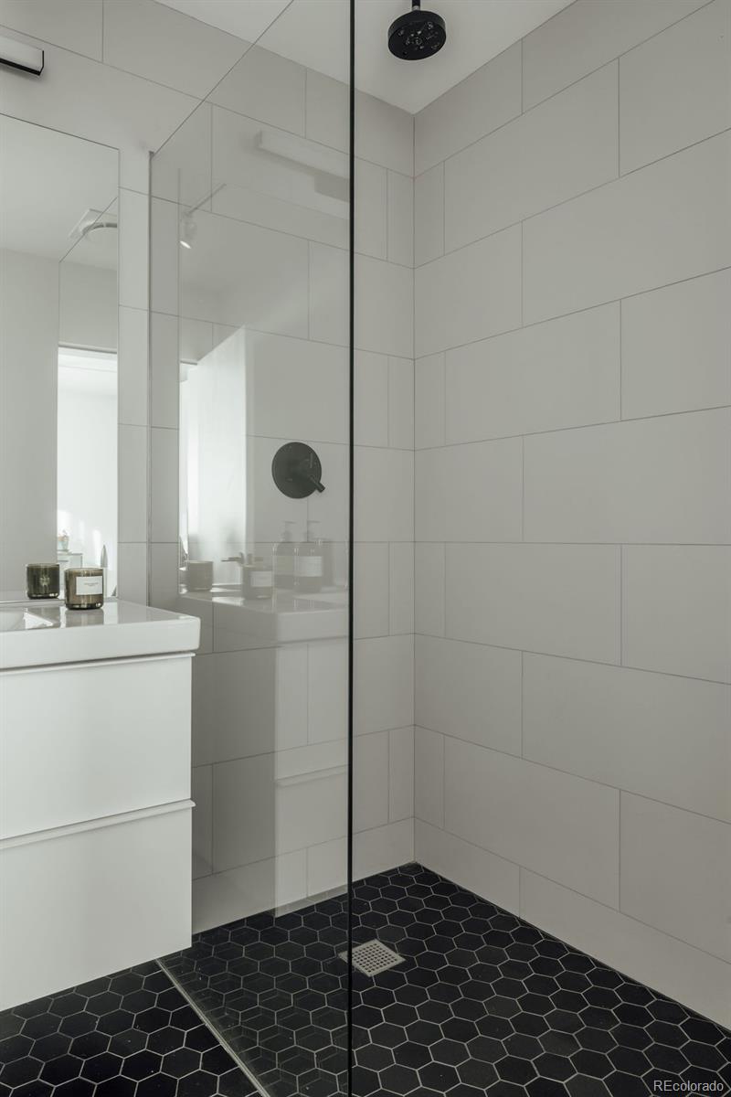 3837 High Street Denver, CO 80205 - Photo 25 of 46 a bathroom with a sink toilet and shower
