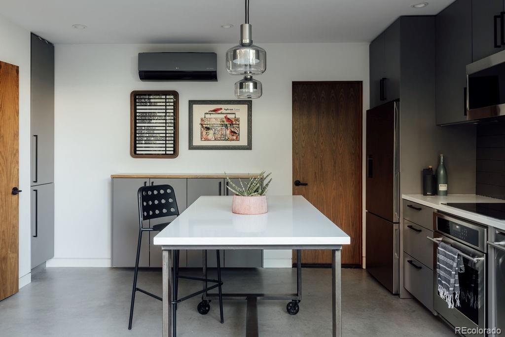 3837 High Street Denver, CO 80205 - Photo 31 of 46 a view of a dining room with furniture