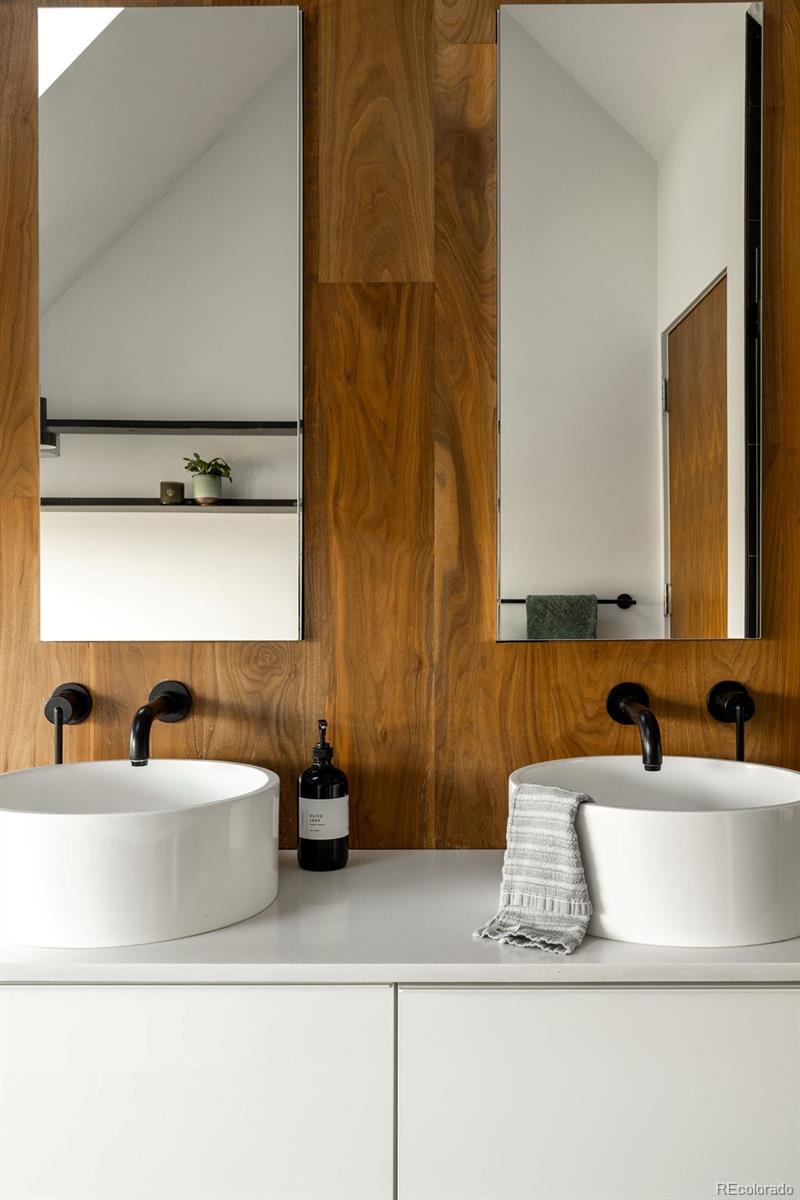 3837 High Street Denver, CO 80205 - Photo 38 of 46 a bathroom with a sink and a mirror