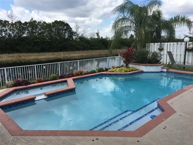 a view of swimming pool with lake view and mountain view