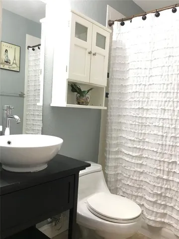 a bathroom with a toilet and a sink
