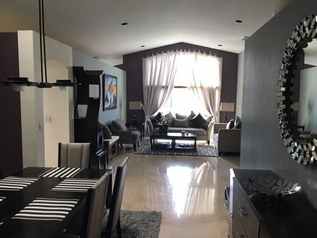 a view of a livingroom with furniture and toys