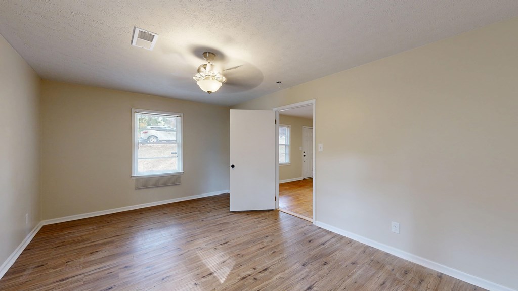 4320 Canady Street Columbus, GA 31909 - Photo 13 of 40 an empty room with wooden floor and windows