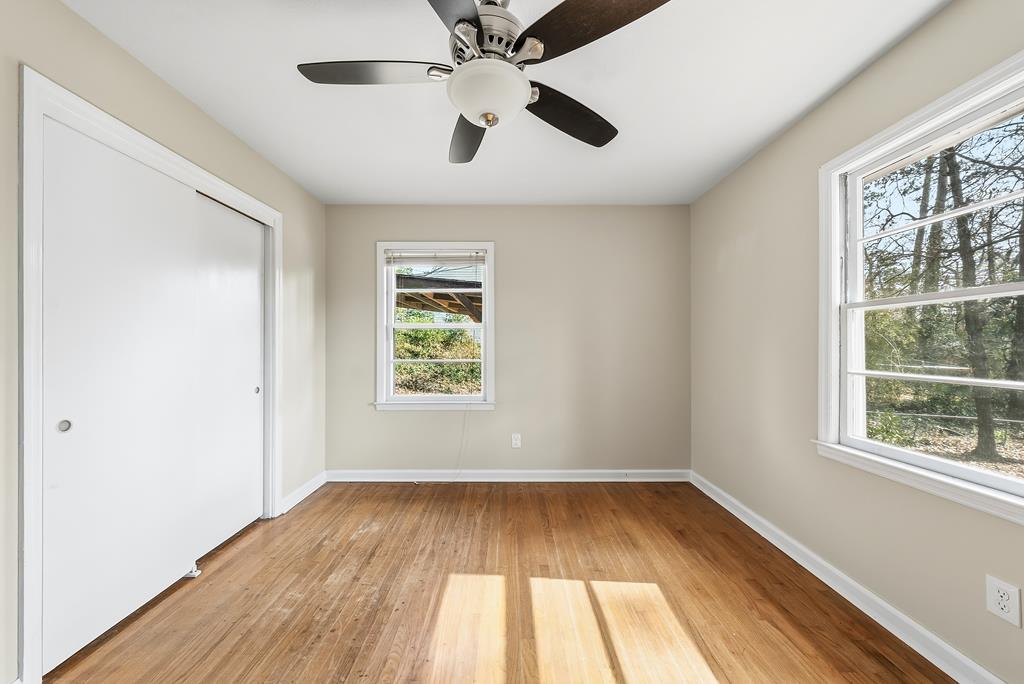 4320 Canady Street Columbus, GA 31909 - Photo 14 of 36 wooden floor in an empty room with a window