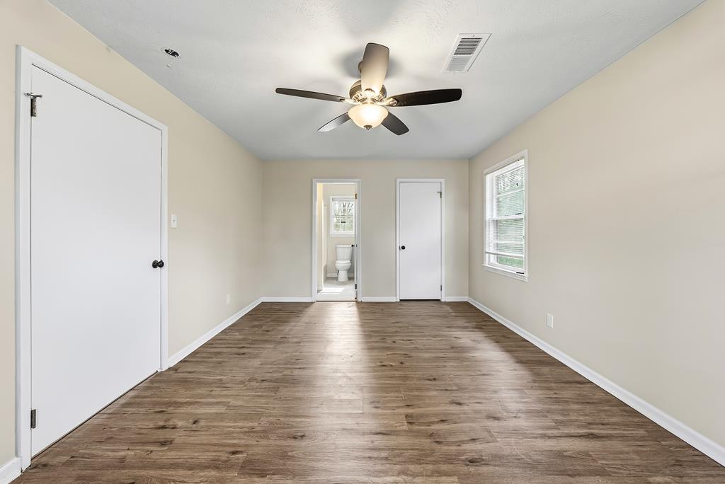 4320 Canady Street Columbus, GA 31909 - Photo 18 of 36 wooden floor in an empty room with a window