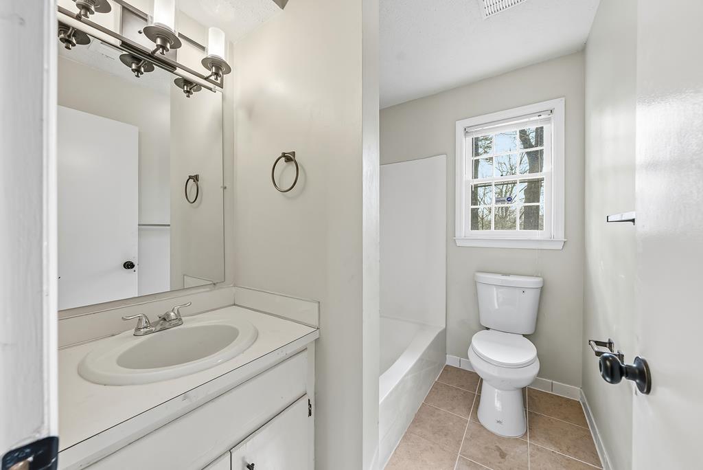 4320 Canady Street Columbus, GA 31909 - Photo 19 of 36 a bathroom with a sink toilet and shower