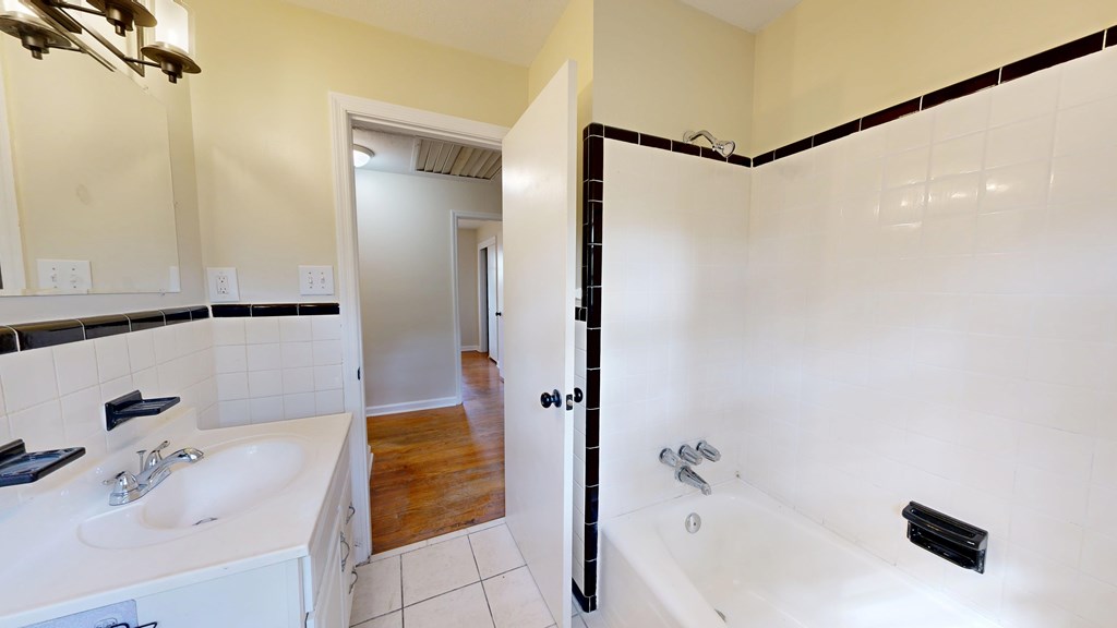 4320 Canady Street Columbus, GA 31909 - Photo 20 of 40 a bathroom with a tub and shower