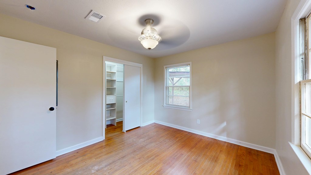 4320 Canady Street Columbus, GA 31909 - Photo 21 of 40 a view of an empty room with wooden floor and a window