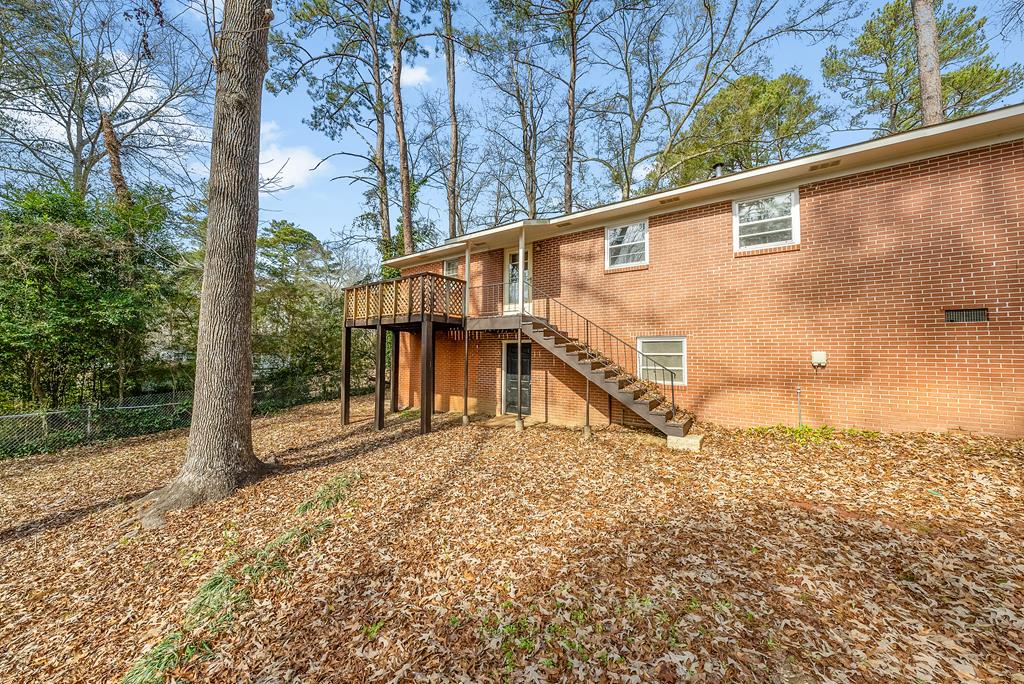 4320 Canady Street Columbus, GA 31909 - Photo 24 of 36 a backyard of a house with lots of green space