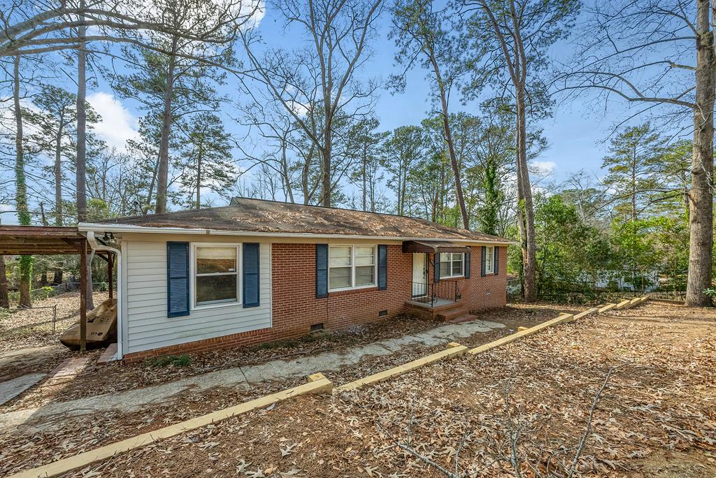 4320 Canady Street Columbus, GA 31909 - Photo 32 of 36 front view of a house with a yard