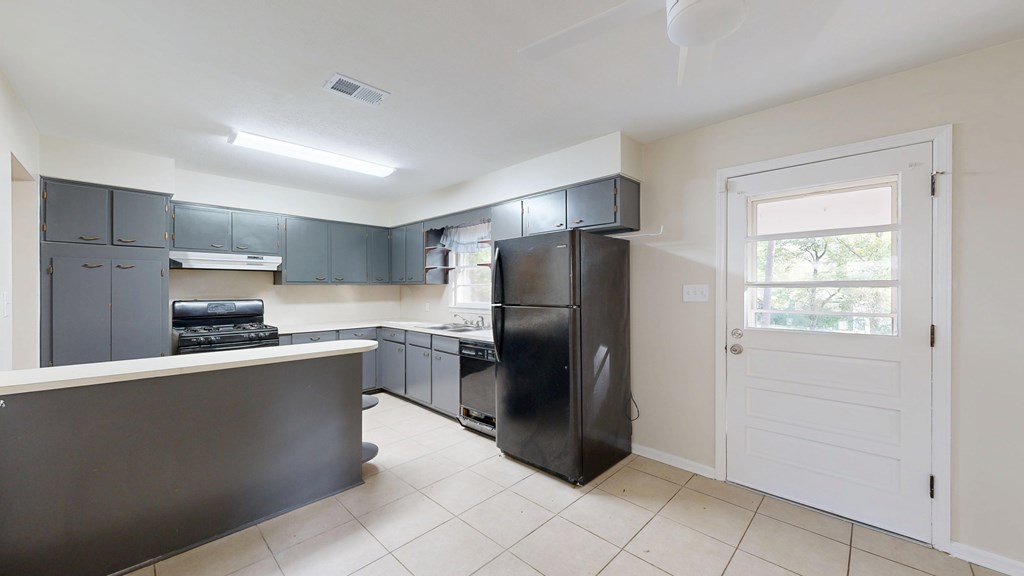 4320 Canady Street Columbus, GA 31909 - Photo 6 of 40 a kitchen with stainless steel appliances granite countertop a refrigerator a sink a stove a microwave and island