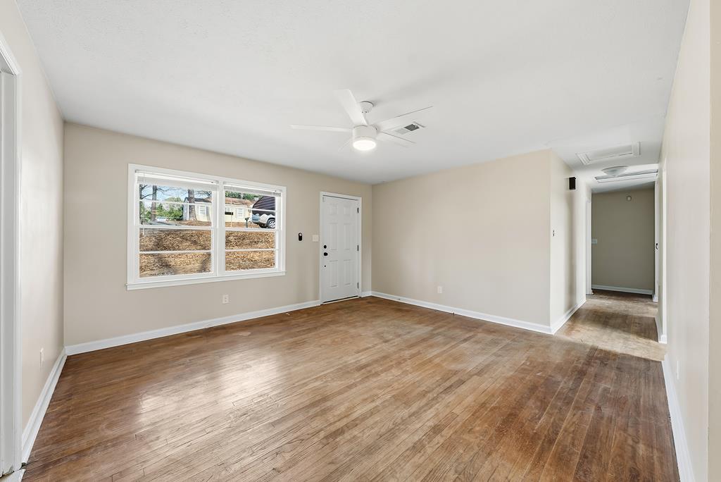 4320 Canady Street Columbus, GA 31909 - Photo 6 of 36 wooden floor in an empty room with a window