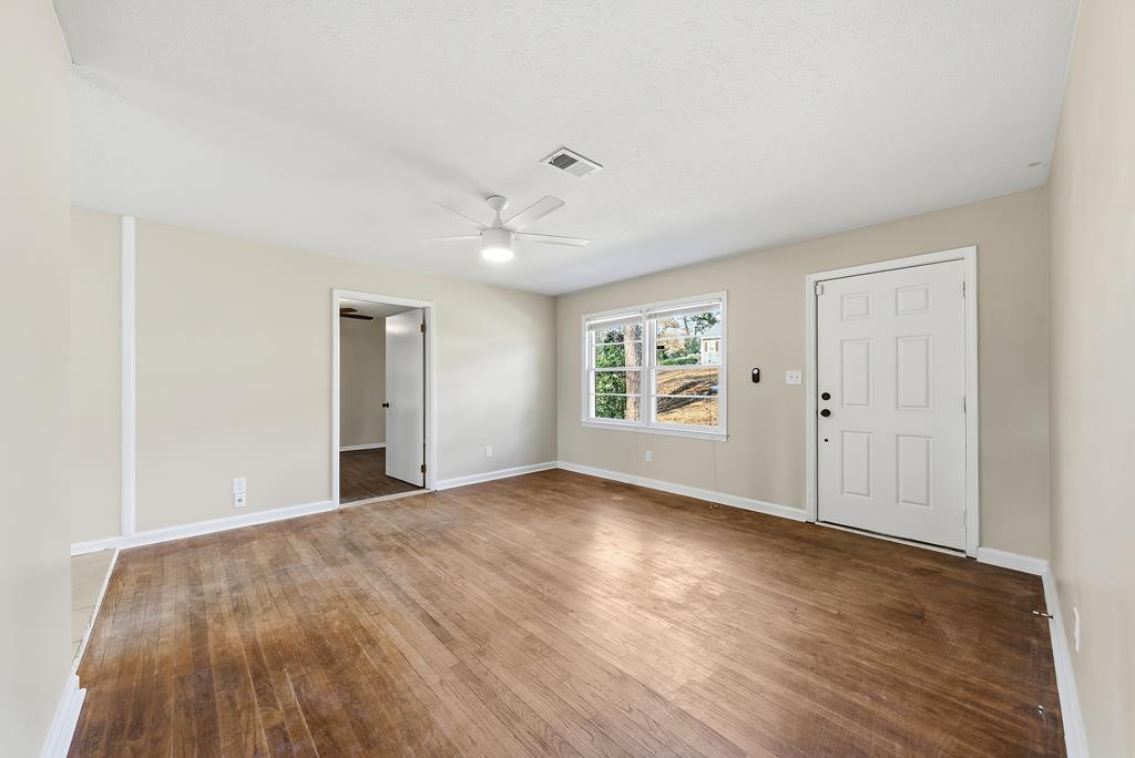 4320 Canady Street Columbus, GA 31909 - Photo 7 of 36 wooden floor in an empty room with a window
