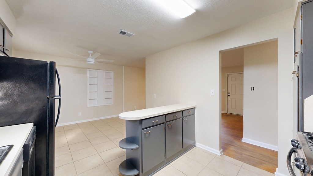 4320 Canady Street Columbus, GA 31909 - Photo 9 of 40 a kitchen with stainless steel appliances a refrigerator and a sink
