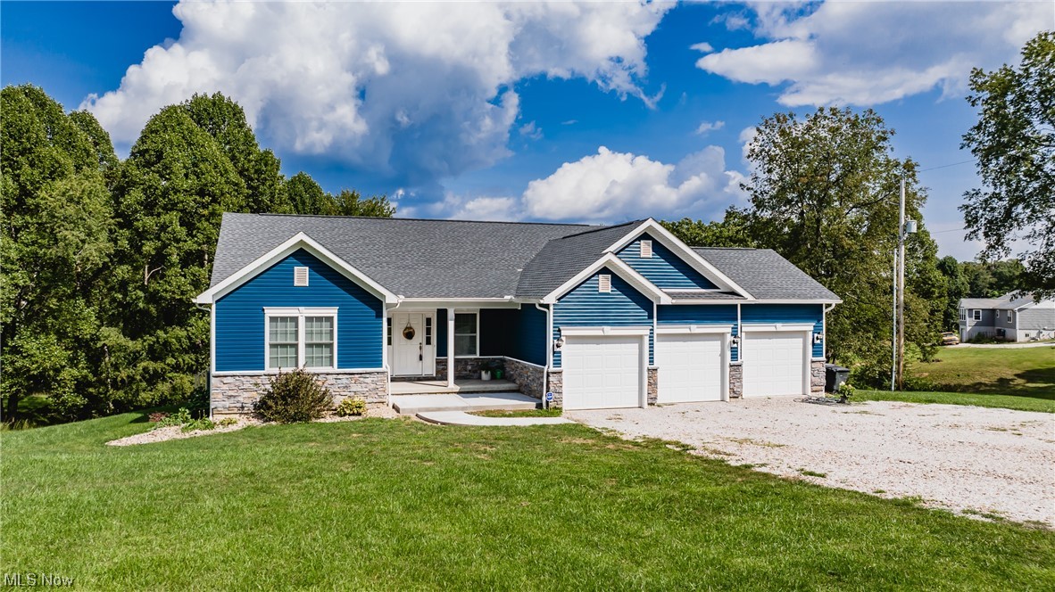 2545 Layman Road Vincent, OH 45784 - Photo 1 of 32 View of front of home with garage and a front lawn
