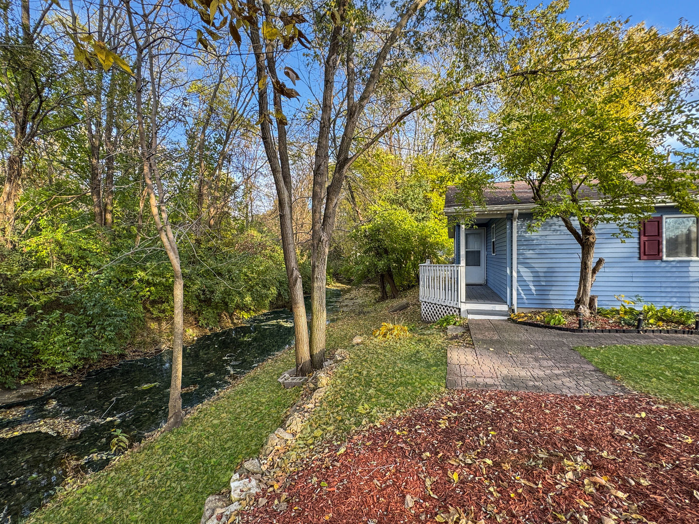 200 East Grove Street Utica, IL 61373 - Photo 2 of 42 a backyard of a house with lots of green space