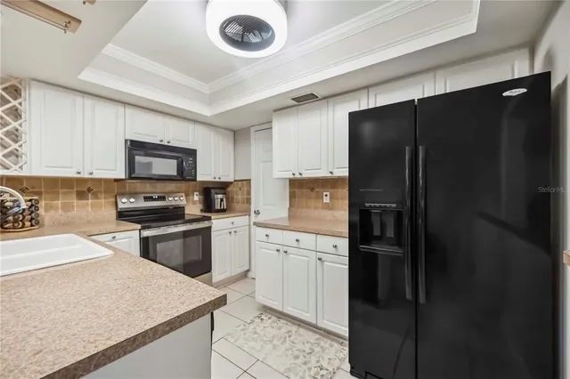 a kitchen with a refrigerator a sink and dishwasher