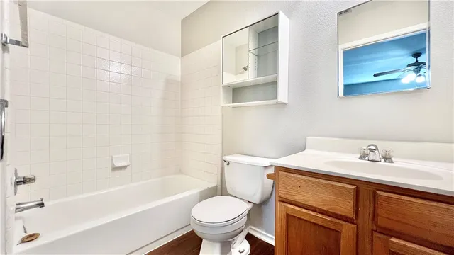 a bathroom with a sink toilet and bathtub