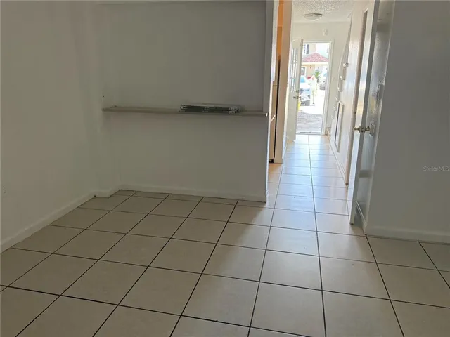 a view of an empty room and window