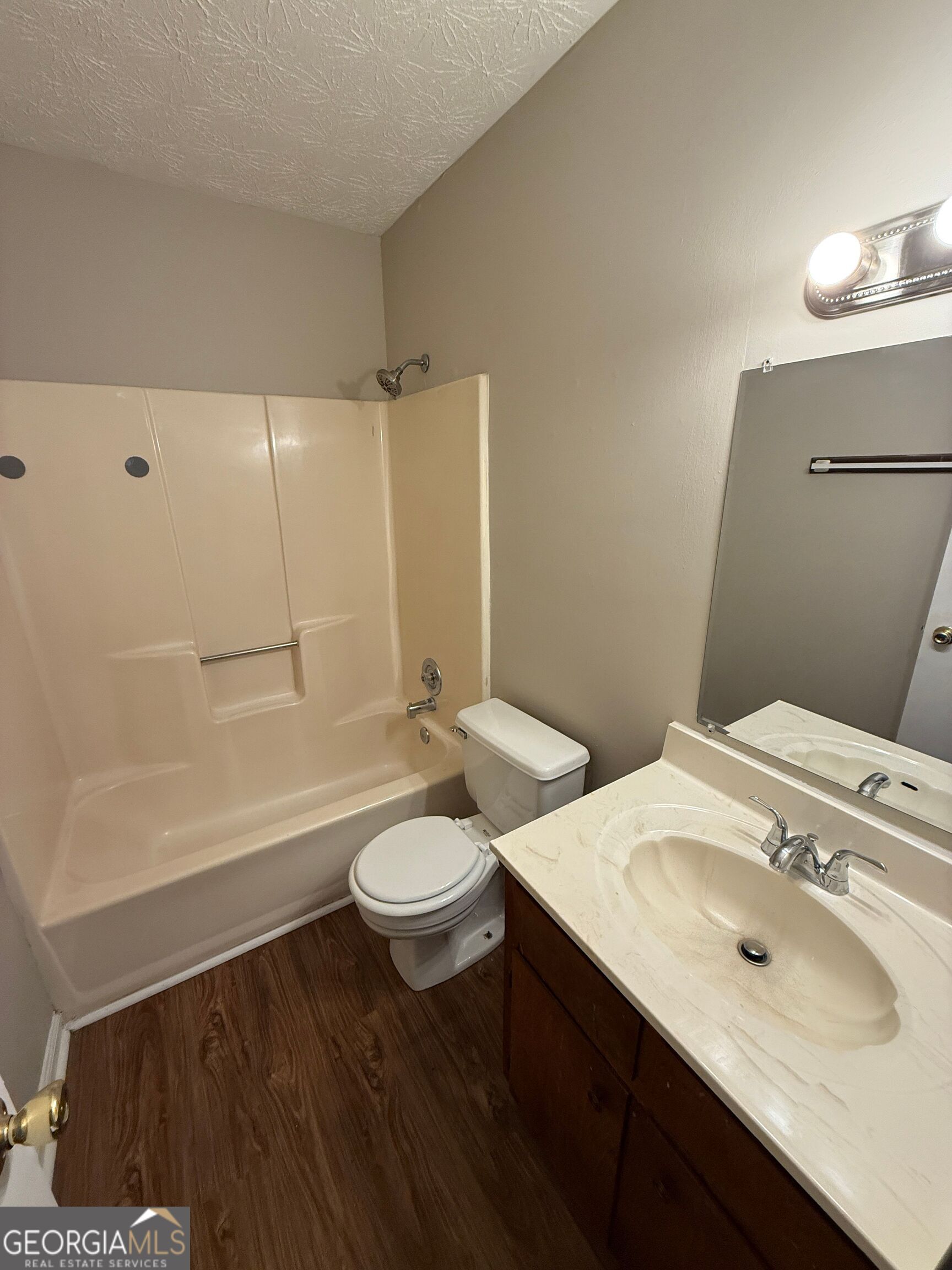 110 St Andrews Court, Unit 110 Athens, GA 30605 - Photo 5 of 13 a bathroom with a sink and a mirror