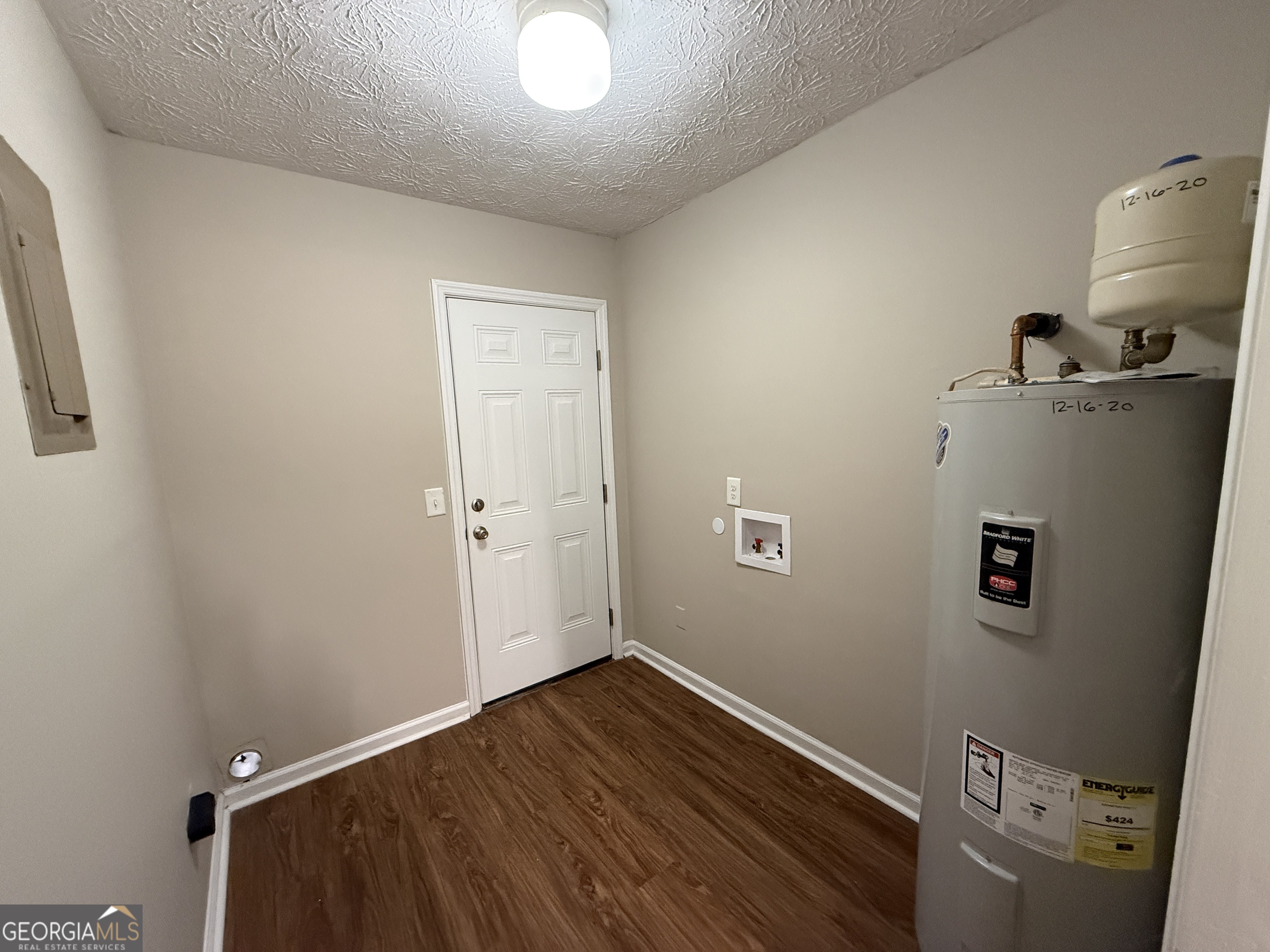 110 St Andrews Court, Unit 110 Athens, GA 30605 - Photo 10 of 13 an empty room with a door